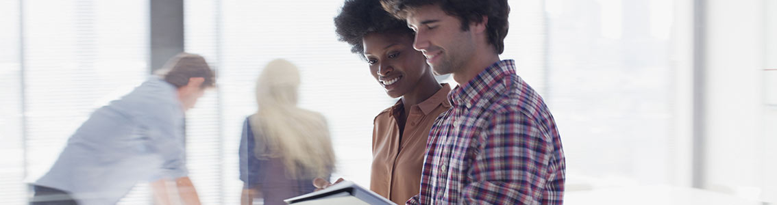 Customer satisfaction management-happy customers looking at tablet