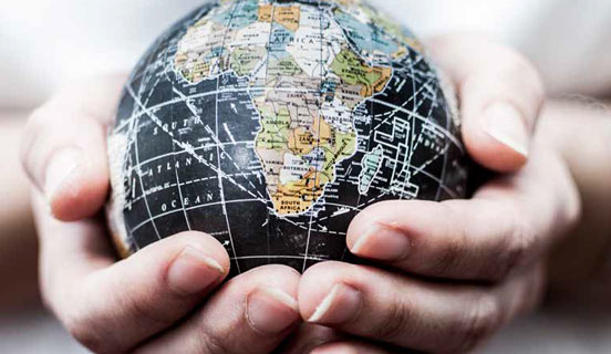 Hands holding globe